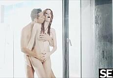Busty redhead rides her man's cock in the shower and gets creampied